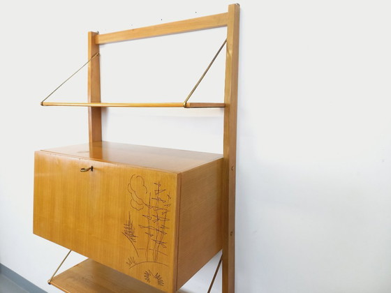Image 1 of Wall-mounted bookcase with vintage light wood and brass secretary bar, dating from the 1960s
