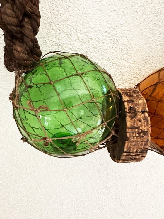 Image 1 of Fishing float made of blown glass, cork, and rope. France, 1960s