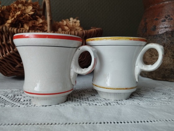 Image 1 of Een paar Sarreguemines ondoorzichtige porseleinen vuurkorfjes (1857-1900)