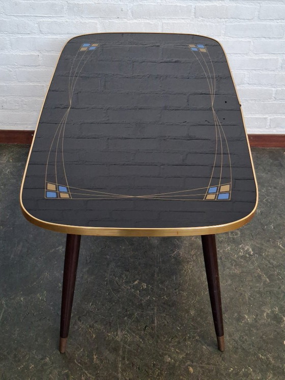 Image 1 of Tavolino da caffè vintage con piano in vetro e gambe inclinate