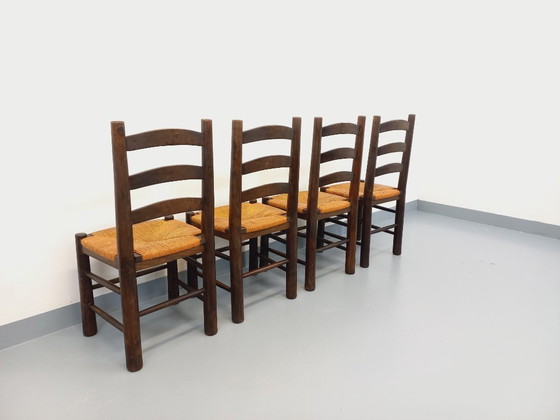 Image 1 of Set van 4 vintage brutalistische stoelen van Georges Robert, gemaakt van hout en stro, uit de jaren 50 en 60.