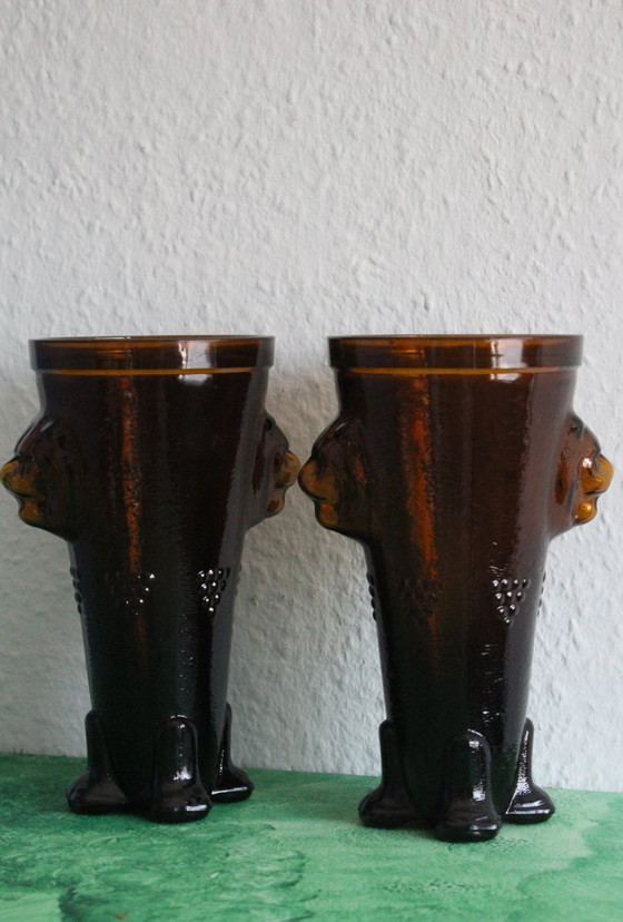 Image 1 of Antique wine tankard made of heavy amber glass with lion heads and paws