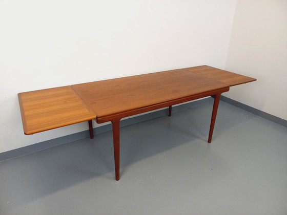 Image 1 of Scandinavian rectangular vintage dining table by Johannes Andersen for Samcom from the 60s in teak with integrated extensions