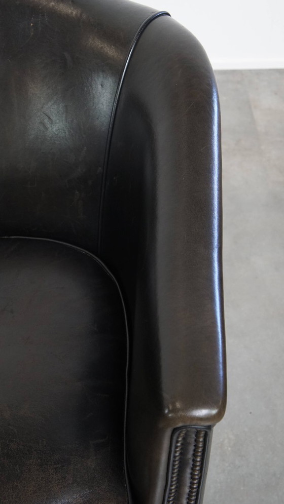 Image 1 of  Set van 2 subtiele zwart/ grijze schapenleren clubfauteuils 