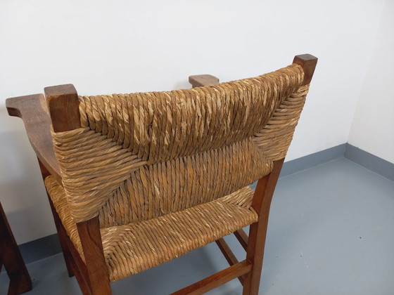 Image 1 of Suite van 2 vintage Brutalistische fauteuils in eiken en stro uit de jaren 60