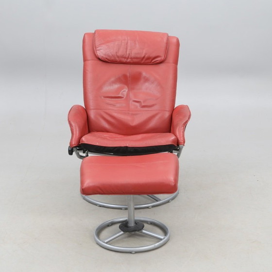 Image 1 of IKEA red leather armchair designed by K. Hagberg – M. Hagberg, from 2000–2010, with a tubular steel tripod base