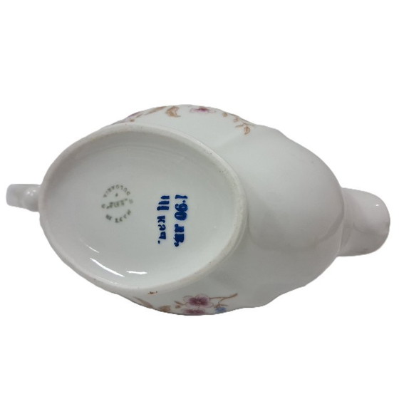 Image 1 of Saucière élégante en porcelaine à décor floral