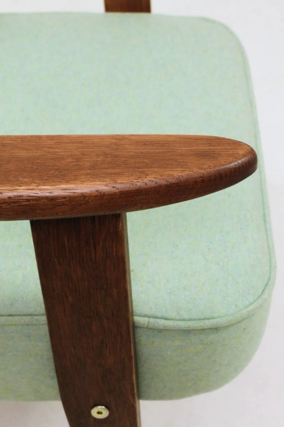 Image 1 of Scandinavische fauteuil met pistachekleurige pastel wollen stof en eikenhout