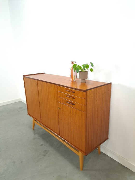 Image 1 of Armadio in teak con gambe inclinate e cassetti dalla Svezia