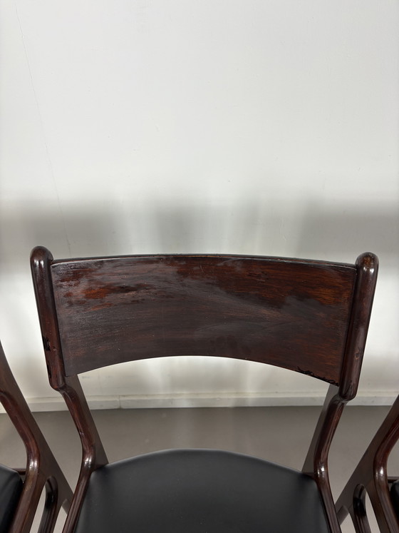 Image 1 of Set off 4 Vintage Palissander Wood With Black skai Leather dining chairs