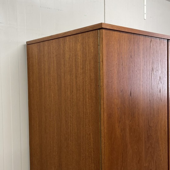Sleek Danish vintage 3-door wardrobe with hanging and shelving – Wood (photo 7 of 12)