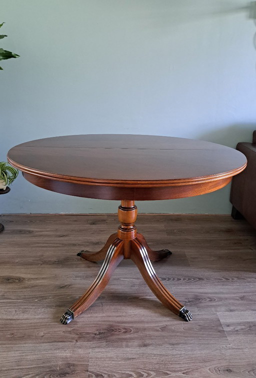 Mahoniehouten eettafel met messing leeuwenpoten