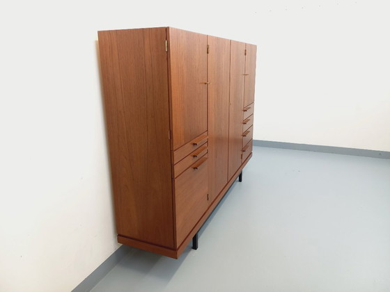 Image 1 of Tall, modernist, vintage Scandinavian sideboard in teak and black metal from the 1960s