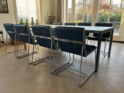 Tavolo da pranzo Leolux Cameleon con 8 sedie in pelle Leolux Spring