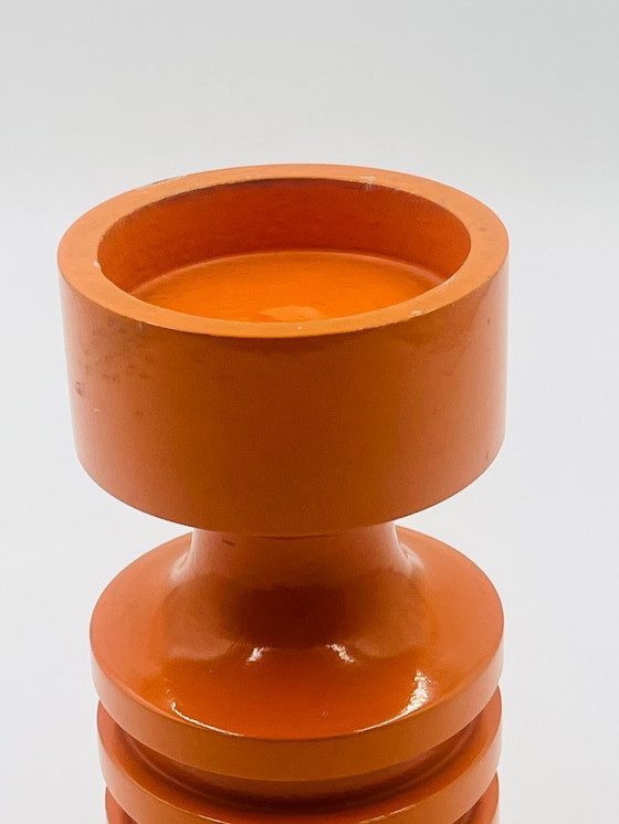Image 1 of Oranje houten kandelaar uit de jaren zeventig