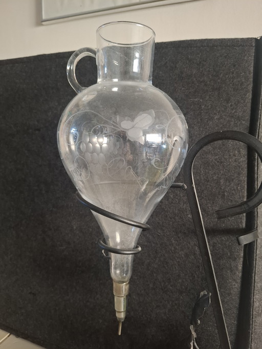 Antique wine pourer / carafe with metal stand