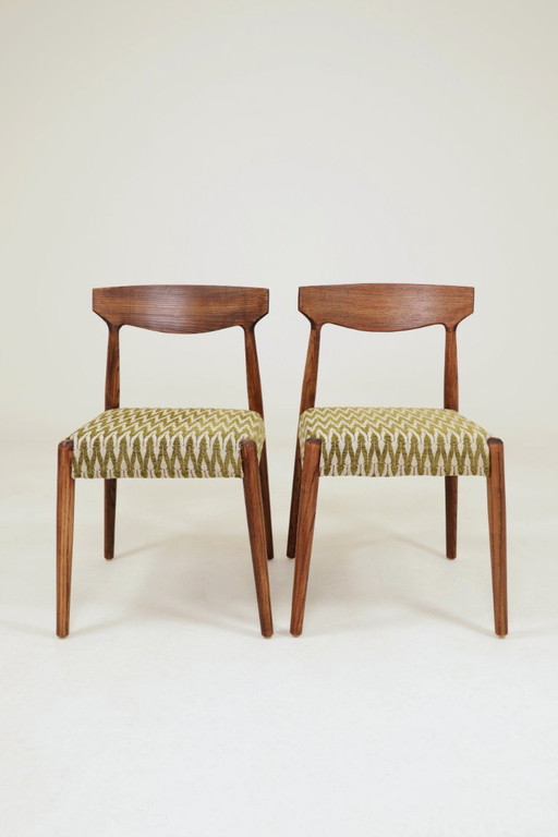 Set van 2 eetkamerstoelen van massief essenhout met groene jacquardstof.