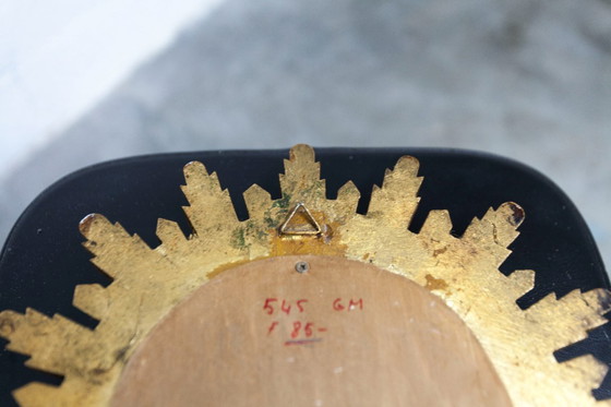 Image 1 of Vintage bolle spiegel uit de jaren 70 met heksenoogmotief en zonnestralenmotief.