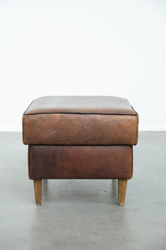 Image 1 of Vintage sheepskin stool with black piping