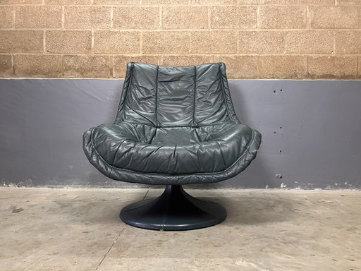 Fauteuil pivotant en cuir vert vintage seventies