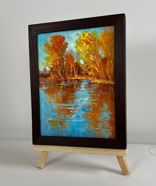 Origineel olieverfschilderij: Herfstlandschap aan een rivier, gouden weerspiegeling van het bos.