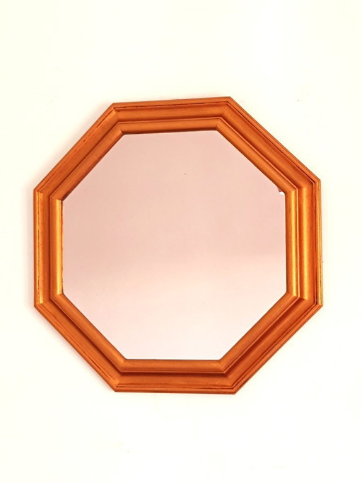 Octagonal wall mirror with gold frame