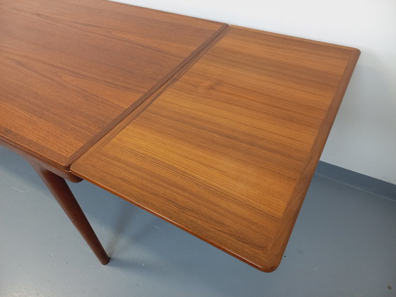 Image 1 of Scandinavian rectangular vintage dining table by Johannes Andersen for Samcom from the 60s in teak with integrated extensions