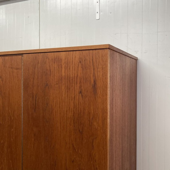 Sleek Danish vintage 3-door wardrobe with hanging and shelving – Wood (photo 6 of 12)