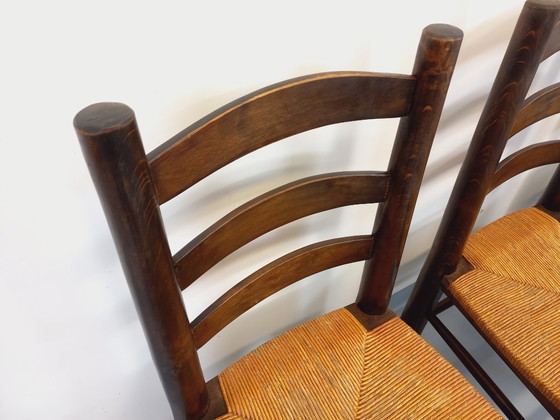 Image 1 of Set van 4 vintage brutalistische stoelen van Georges Robert, gemaakt van hout en stro, uit de jaren 50 en 60.