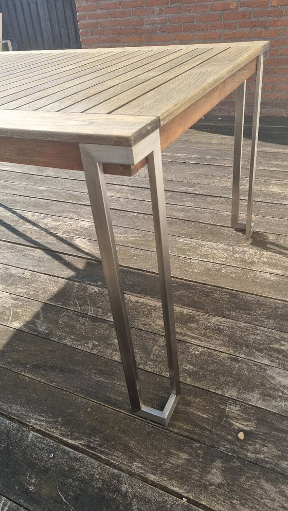 Image 1 of Set da giardino con tavolo in teak e 4 sedie in acciaio inox, realizzato in teak e textilene.