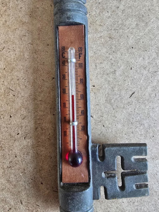 Old key thermometer with deer