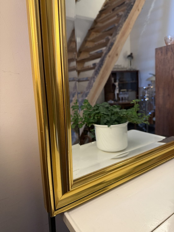 Image 1 of Large facet-cut mirror in a gold-colored frame
