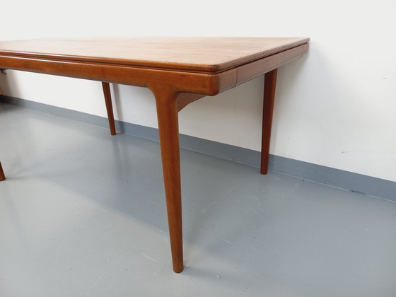 Image 1 of Scandinavian rectangular vintage dining table by Johannes Andersen for Samcom from the 60s in teak with integrated extensions