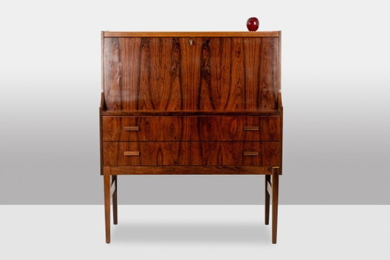 Image 1 of Commode van palissanderhout met 2 laden, die tevens als secretair dient. Jaren 70.