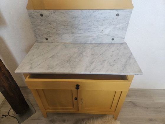 Image 1 of Vintage ochre yellow sideboard with marble top and mirror