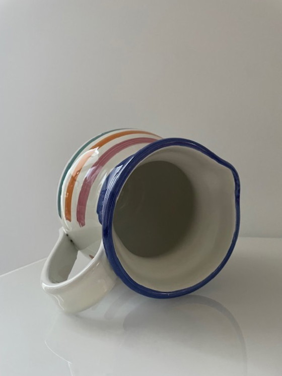 Image 1 of Handgemaakte vintage schenkkan met kleurrijke strepen