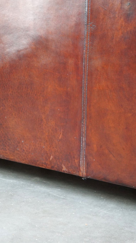 Image 1 of Cómodo sofá de piel de oveja de 2,5 plazas con cojines de tela