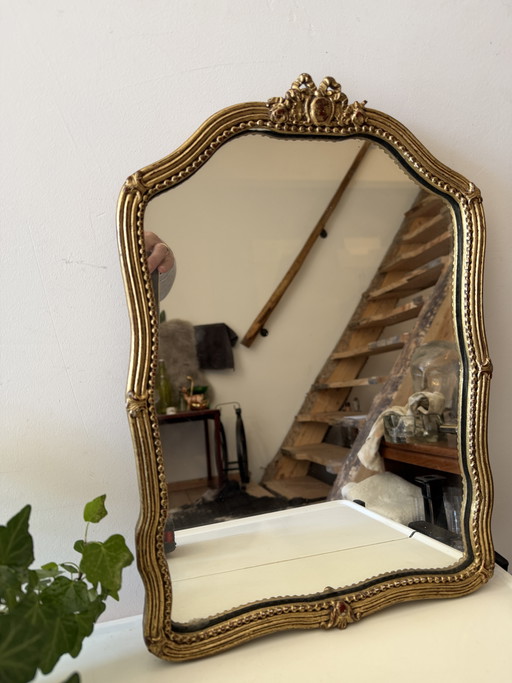 Specchio vintage degli anni '20 con cornice color oro