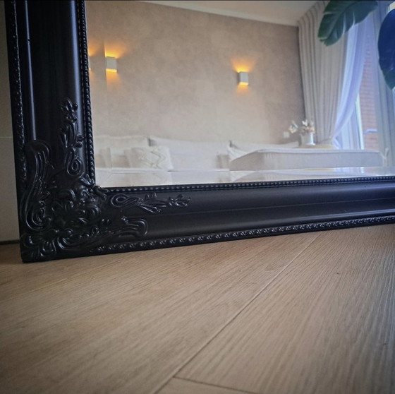 Image 1 of Large black hotel chic mirror with facet