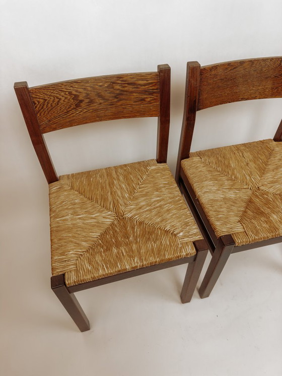 Image 1 of 2x Vintage wengé houten eetkamerstoelen met gevlochten zitting