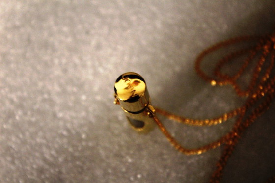 Image 1 of Jovan parfumhanger met ketting, goudkleurig, met glazen flesje, vintage, zeldzaam