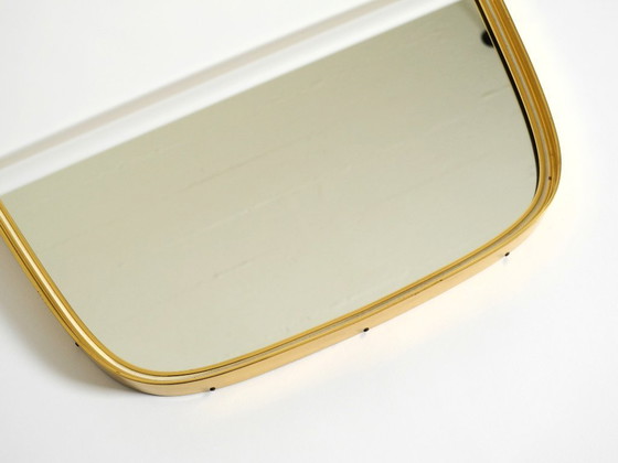 Image 1 of A pair of rare original Mid Century Modern "Münchener Zierspiegel" wall mirrors with heavy brass frames