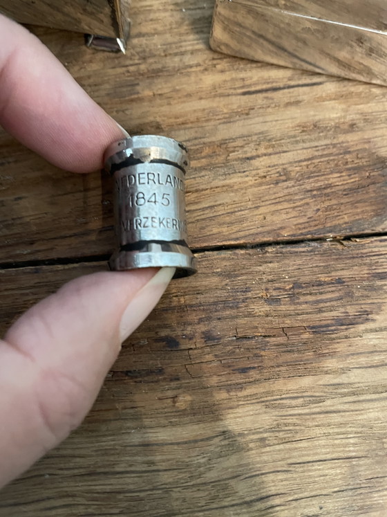 Image 1 of Estuches para cigarrillos y apagavelas, chapados en plata.