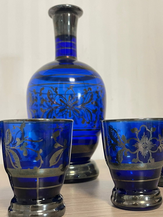 Image 1 of Rosolio-fles: 1 fles en 12 met zilver versierde glazen.