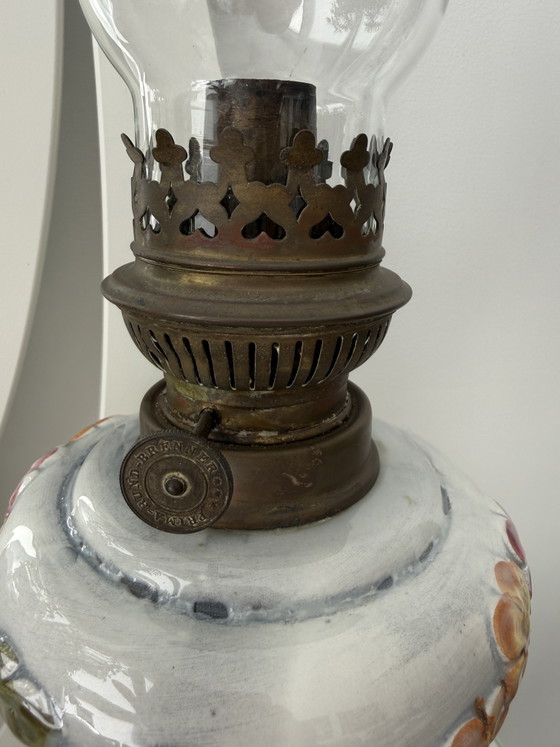 Image 1 of Antique kerosene lamp with ceramic floral decoration and P&A burner – ca. 1900