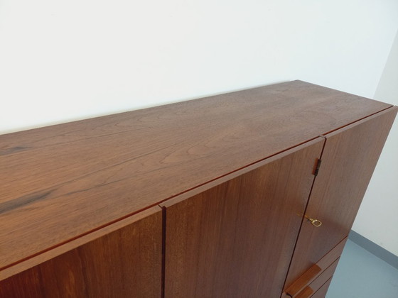 Image 1 of Tall, modernist, vintage Scandinavian sideboard in teak and black metal from the 1960s