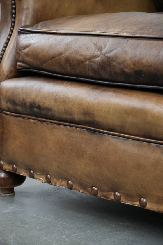 Image 1 of Ohrensessel im englischen Stil aus Kuhfell