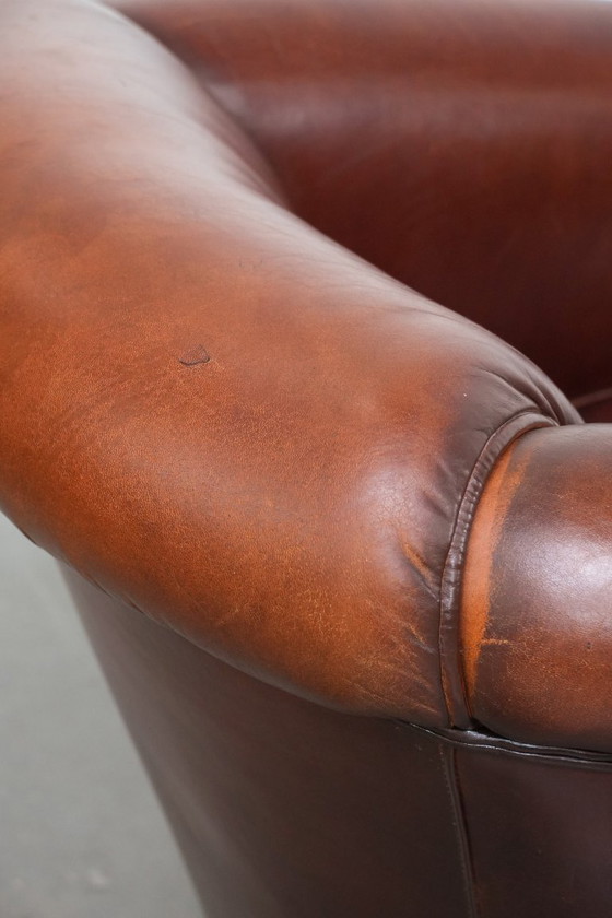 Image 1 of Vintage schapenleren clubfauteuil met siernagels