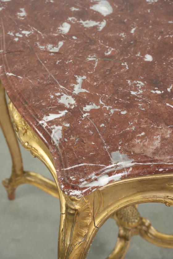 Image 1 of Antique French side table/center table from the 19th century with a gold-colored wooden frame and an original marble tabletop.