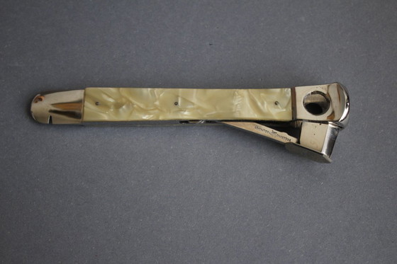 Image 1 of Tagliasigari vintage Solingen a forma di freccia con manico in madreperla, nella confezione originale.